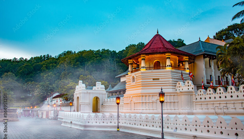 Temple of the tooth, a Buddhist temple also known as Sri Dalada Maligawa, covered with fog in Kandy, Sri Lanka. morning view, well famous destination among tourists.
