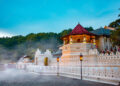 Temple of the tooth, a Buddhist temple also known as Sri Dalada Maligawa, covered with fog in Kandy, Sri Lanka. morning view, well famous destination among tourists.