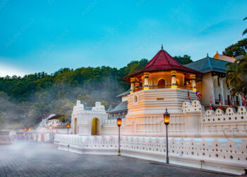 Temple of the tooth, a Buddhist temple also known as Sri Dalada Maligawa, covered with fog in Kandy, Sri Lanka. morning view, well famous destination among tourists.