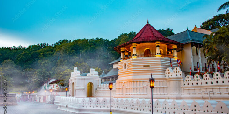 Temple of the tooth, a Buddhist temple also known as Sri Dalada Maligawa, covered with fog in Kandy, Sri Lanka. morning view, well famous destination among tourists.
