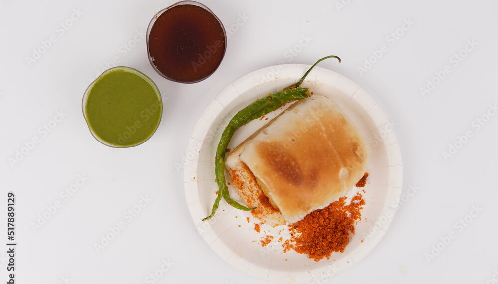 Mumbai's Vadapav In plate With Green Chutney and imli [tamarind] Chutney