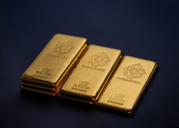 Three gold bars stacked on top of each other