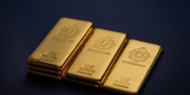 Three gold bars stacked on top of each other